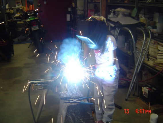 young girl welding.png