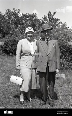 1950s-historical-outside-wearing-tbeir-sunday-best-perhaps-for-a-wedding-as-they-are-both-wear...jpg